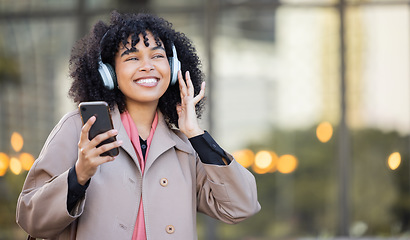Image showing Smile, happy or black woman with music in city, radio or podcast on headphones walking in street or to office. Startup, employee or worker travel on smartphone, 5g network or audio in New York
