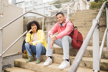 Image showing Portrait, stairs and students with a man and black woman sitting outdoor on campus together at university for education. Scholarship, college and school with a male and female pupil seated on steps