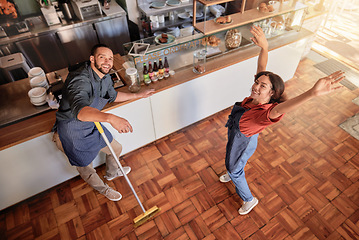 Image showing Coffee shop, portrait and barista couple cleaning, having fun and bonding in their restaurant. Startup, small business and top view of young owners or entrepreneurs preparing their cafe for work.