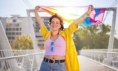 Image showing Portrait, pride and lesbian woman with flag on city bridge, lgbtq community, identity with support and equality in love Rainbow, lifestyle and lgbt awareness, inclusion and celebrate with sexuality
