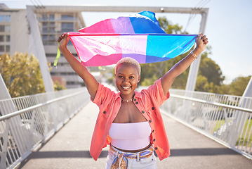 Image showing Portrait, pride and black woman with flag on city bridge, lgbtq community and lesbian, identity and equality in love. Rainbow, outdoor and lgbt awareness, inclusion and celebration with sexuality