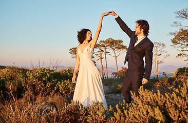 Image showing Love, wedding and holding hands for dance with couple in nature park for celebration, romance and happiness. Sunset, support and summer with bride and groom for marriage, ceremony and bonding