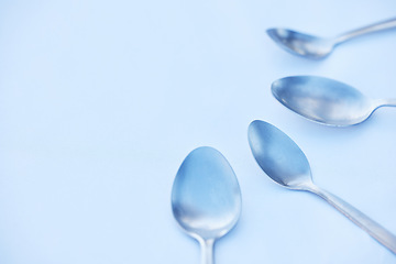 Image showing Kitchen, cutlery and spoon on a table as a group with mockup to represent community, charity or donation. Cooking, metal and space with steel utensils on a surface from above to volunteer or donate