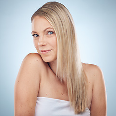 Image showing Skincare, beauty and portrait of a woman with hair care isolated on a blue background in a studio. Spa, wellness and cosmetology model with facial makeup, cosmetics and dermatology on a backdrop