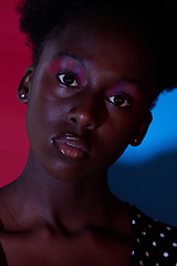 Image showing Trendy, aesthetic and portrait of black woman in dark color lighting isolated on a studio background. Neon, art and face of an African girl with creativity, makeup and stylish on a creative backdrop