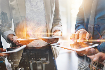 Image showing Hands, tablet and group overlay of business people networking on digital technology. City double exposure, devices or teamwork of employees with touchscreen and mobile phones for communication online