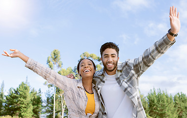 Image showing Portrait, couple of friends and freedom of hiking in nature, forest and park. Diversity, man and woman celebrate journey, achievement and adventure on blue sky with motivation, smile and happiness