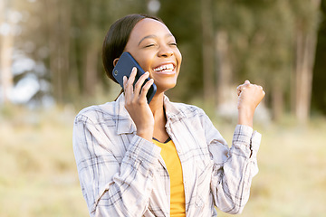 Image showing African woman, celebrate and fist with phone call, outdoor or smile for winning, success or goal in summer. Adventure, smartphone conversation or good news for girl in sunshine, forest or celebration