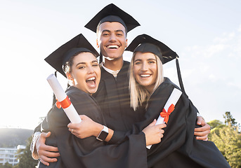 Image showing Student graduation, group portrait and hug for celebration, success and education event outdoor. Diversity, smile and excited graduates celebrate at happy campus, university goals and college support