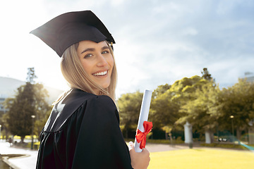 Image showing Woman, student and smile for graduation, diploma or achievement in higher education. Portrait of happy female academic learner holding certificate, qualification or degree for university scholarship