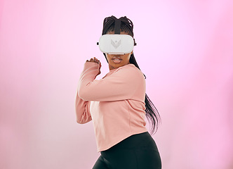 Image showing Black woman, VR and gamer in the metaverse for futuristic gaming or activity against a pink studio background. African American female in 3D virtual reality game with headset in the future on mockup