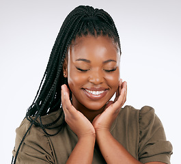 Image showing Happy, calm and black woman smile with skincare, beauty and facial wellness in studio. White background, isolated and skin glow of relax african model with dermatology, cosmetics and face self care