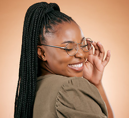 Image showing Happy black woman, face and holding glasses with smile, vision and excited, prescription lens isolated on studio background. Eyewear, eye care and healthcare for eyes, fashion frame and optometry