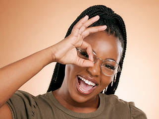 Image showing Black woman, portrait smile and ok hand sign for perfect, great or right against studio background. Happy African American female smiling in happiness showing okay emoji gesture for positive attitude