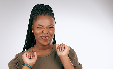 Image showing Silly, happy and black woman face with sassy emoji attitude facial expression in studio. White background, isolated and young model with fashion fashion with comic, crazy and goofy gesture alone