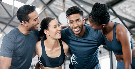 Image showing Diversity, fitness and team building for exercise, workout or training together at the indoor gym. Happy diverse group of people smile in sports teamwork, huddle or hug for healthy exercising support