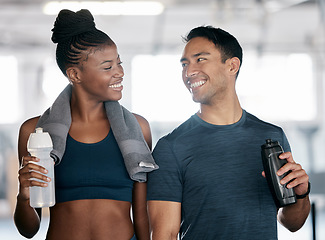 Image showing Fitness, black woman or personal trainer drinking water in training, workout or exercise on relaxing break. Coaching, partnership or sports athletes with healthy liquid for hydration or energy at gym