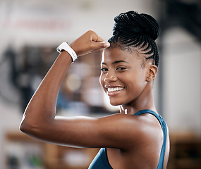 Image showing Portrait, fitness or black woman flexing muscle or body goals in training, workout or exercise at gym. Strong person, results or healthy African girl athlete with powerful biceps, motivation or focus