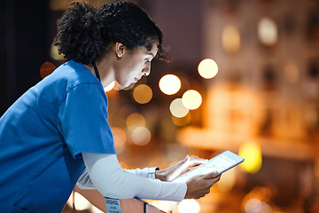 Image showing Tablet, woman and nurse on hospital rooftop working on telehealth, research or online consultation in city. Bokeh, healthcare physician and female with technology for wellness app in clinic at night.