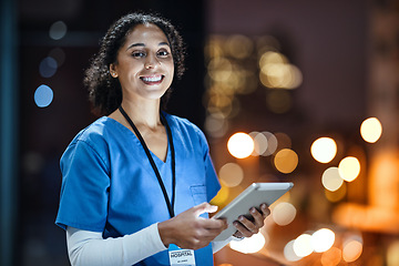 Image showing Tablet, city and portrait of a woman doctor doing research at night on rooftop of hospital building. Medical, lights and female healthcare worker working late on mobile device on balcony of clinic.