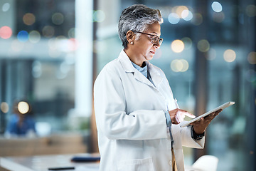 Image showing Hospital, tablet and senior doctor working online for medical report, planning and research in clinic. Technology, healthcare and woman with digital tech for telehealth, insurance and consultation