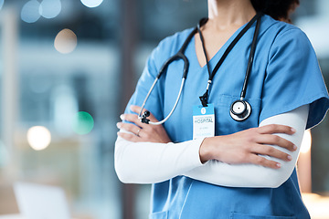 Image showing Woman arms crossed, doctor and night in hospital, workplace and medical career vision on nightshift. Confident healthcare expert, dark clinic and focus goal with hands, safety and help for emergency