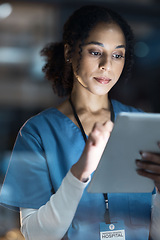 Image showing Medical tablet, nurse and black woman in hospital working late on telehealth, research or online consultation. Tech, healthcare or female physician with technology for wellness app in clinic at night