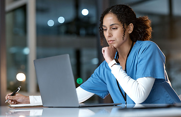 Image showing Doctor, thinking and writing with laptop at night for healthcare solution, idea or planning at hospital. Woman medical nurse working late in focus for research with notebook and computer at clinic