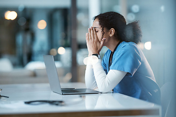 Image showing Burnout stress, nurse and black woman in hospital feeling pain, tired or sick on night shift. Healthcare, wellness and female medical physician with depression or anxiety while working late on laptop