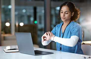 Image showing Laptop, watch and night with a black woman nurse working overtime on research in a hospital for healthcare. Computer, medical and time with a female medicine professional at work late in the evening