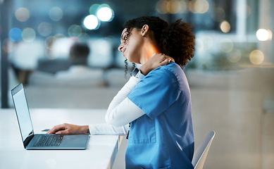 Image showing Doctor, laptop and neck pain at night in stress, overworked or burnout by desk at the hospital. Woman medical professional suffering from painful injury, ache or inflammation working late on computer