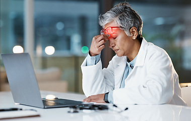 Image showing Night, stress and headache with doctor at laptop for medical, thinking and deadline review. Burnout, accountability and mental health with senior woman for healthcare, medicine and science research