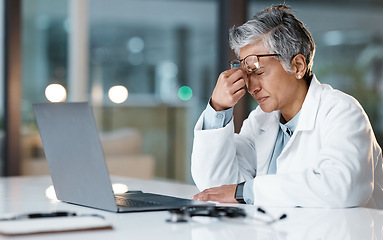 Image showing Night, stress and headache with face of doctor for medical, thinking and deadline review. Burnout, compliance and mental health with black woman for healthcare, medicine and science research