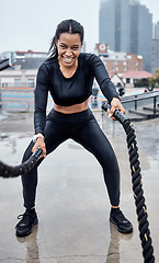 Image showing Fitness, exercise and black woman with rope in city for cardio workout, training and sports wellness. Motivation, focus and portrait of female athlete with gear for strong muscles, power and energy