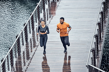 Image showing Top view, run or couple training, seaside or workout for wellness, healthy lifestyle or practice together. Running, black man or woman with exercise, promenade or performance with endurance or energy