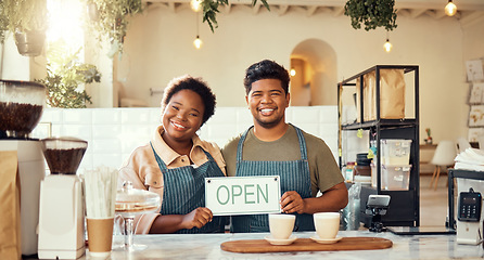 Image showing Portrait, couple and open sign by restaurant owners happy at coffee shop or cafe in support together. Partnership, collaboration and team smiling due to startup growth and proud of success or vision