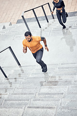 Image showing Fitness, rain and people running outdoor for muscle wellness, music and energy in winter focus. Urban stairs, Black man, runner couple or personal trainer speed for cardio workout or exercise above