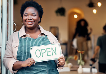 Image showing Open sign, portrait and black woman in small business startup for shopping, customer service and retail success. Boss, manager or person hand holding board for welcome in new store with smile at door