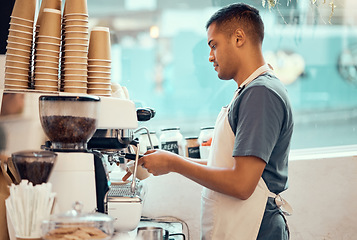 Image showing Cafe, coffee machine and man barista working on a espresso or latte order in the restaurant. Morning, cafeteria and male waiter from Mexico preparing a caffeine or tea warm beverage in a coffee shop.