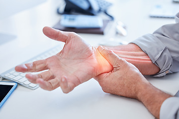 Image showing Closeup, business and man with wrist pain, while working and overworked with muscle strain, office and injury. Zoom, male employee or consultant holding hand, suffering from arthritis or inflammation