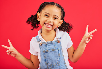 Image showing Happy, peace sign and portrait of girl smile on red background with trendy, stylish and cute summer outfit. Kids fashion, freedom and face of child with emoji, comic and meme hand gesture in studio