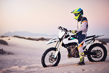 Image showing Moto cross, sand landscape or man on bike stop for sport workout, sunset ride or exercise on hill. Nature, sky or male on motorcycle freedom adventure in Dubai desert for training, fitness or race