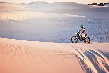 Image showing Desert, moto cross and extreme motorbike sport of a man on sand dunes in Africa doing fitness. Driving challenge, beach adventure and cycling travel of a athlete in nature training for moto cross