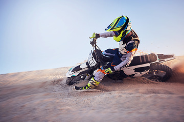 Image showing Moto cross, sand hill or man on bike for extreme sport workout, sunset ride or exercise on dirt. Nature, sky or person riding for speed adventure in Dubai desert for training, fitness or race