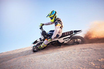 Image showing Motorcycle, athlete and sports outdoor, fitness and riding in desert with stunt for extreme sport, fast and safety helmet. Challenge, power and biking exercise, person training and dirt bike rally