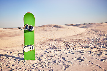 Image showing Sandboard, sports and nature with desert sand, dunes and hills with no people and sport equipment. Exercise, fitness, and mockup of deserted landscape in Dubai with bike tracks and mock up space