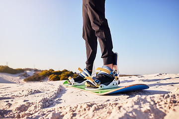 Image showing Sandboard, sports and athlete in the desert sand with hills for exercise, competition or training. Fitness, travel and man on a board in a dune for a workout while on vacation or adventure in Dubai.