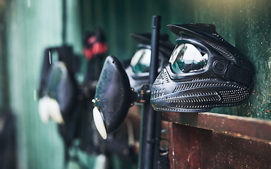 Image showing Paintball, equipment and helmets or mask for protection for sports, competition or fun game. Sport, paint ball and safety gear for a recreation battle or competitive match by an outdoor battlefield.
