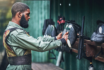 Image showing Paintball man, prepare safety mask and clothes with gear, camouflage and start for outdoor combat game. African guy, war games or adventure for training, shooting or training for tactical development