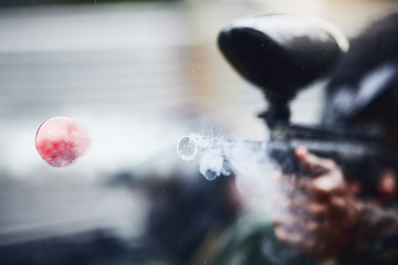 Image showing Closeup, person and paintball gun shooting with ball for fun, extreme and sport, fitness and training. Zoom, marker, and target, practice and game with people competing, speed and power